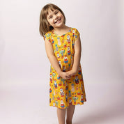Red and green holly print festive holiday dress with tropical style, perfect for Christmas beachwear. | Tropicool Clothing