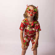 Red Happy Santa Kids Shirt with festive Christmas print, paired with matching red and white Christmas pajamas. | Tropicool Clothing