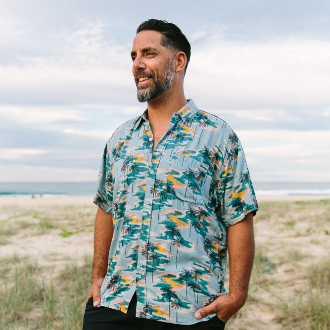 Palm Dreams Hawaiian shirt with vibrant palm tree pattern and bold tropical colors, perfect for vacations. | Tropicool Clothing