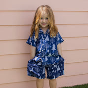 Navy Christmas kids shirt with white reindeer and tree patterns, festive blue outfit, holiday tropical style. | Tropicool Clothing