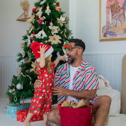 Jolly Stripe Christmas adult shirt featuring red, white, and green stripes; festive holiday tropical style. | Tropicool Clothing