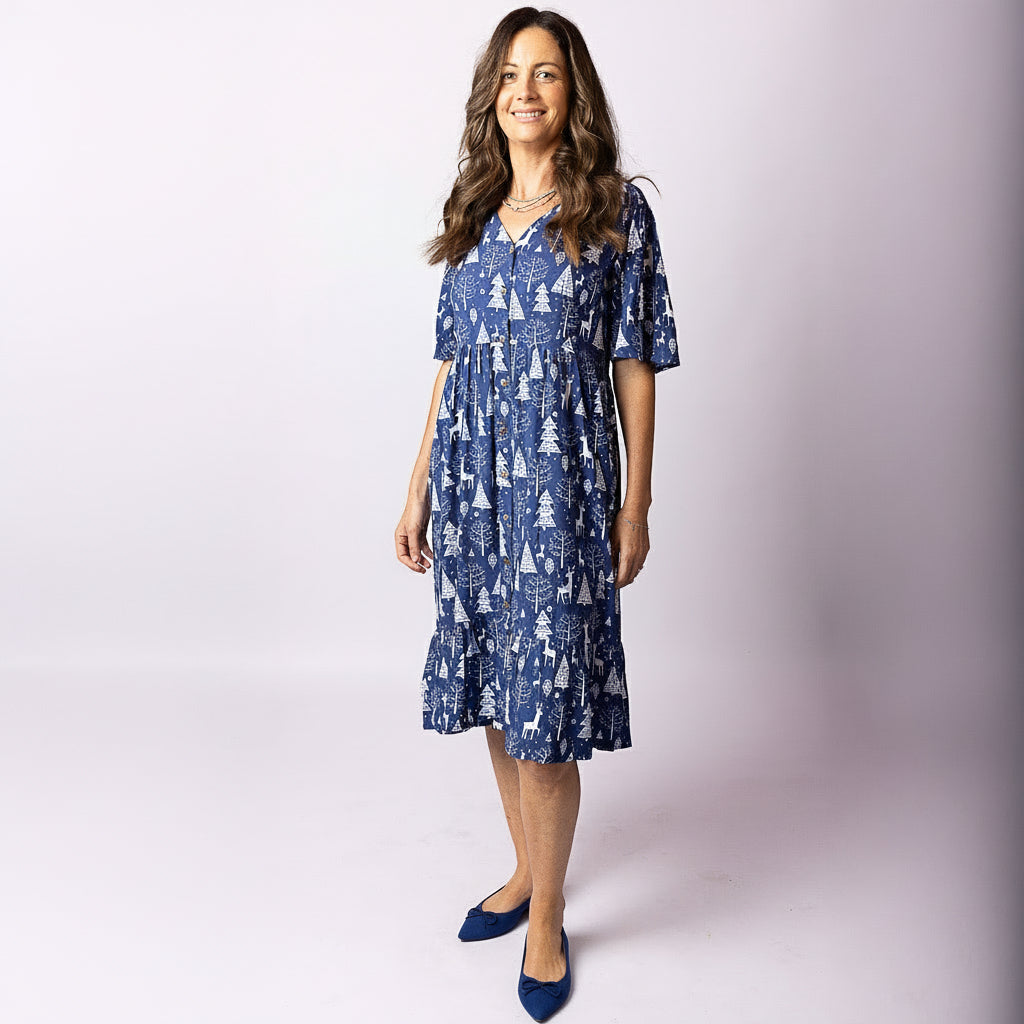 Woman wearing Tropicool Alice Reindeer Navy Christmas dress, front view, showcasing relaxed fit and festive print