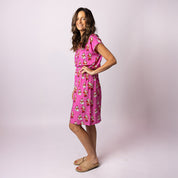 Model in Alice Santa Polka Pink Adult Dress showing relaxed fit and bright Santa print – Tropicool Australia women’s Christmas dress for holiday events and family photos