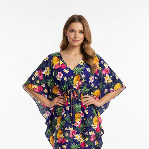 A navy blue kaftan with a tropical floral pattern, featuring a belt tie at the waist.