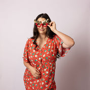 Three-quarter view of the Tropicool Alice Gingerbread Jest Christmas dress, showing the relaxed fit and playful gingerbread print