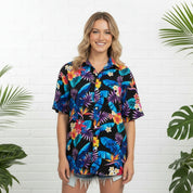 Paradise Crush cotton adult shirt with vibrant tropical print, paired with classic blue denim shorts. | Tropicool Clothing