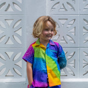 Rainbow print kids’ shirt and shorts set with multicolor stripes, tropical festive summer style. | Tropicool Clothing