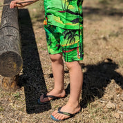 Sunset Green Kids Shorts with a solid bright green color, perfect for tropical summer outfits. | Tropicool Clothing