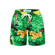 Kids sunset green shorts with vibrant tropical floral print and white drawstring waistband, festive style. | Tropicool Clothing