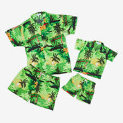 Green Hawaiian shirt and shorts set with sunset-toned palm tree print; tropical festive kids apparel. | Tropicool Clothing