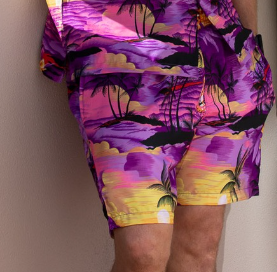 Sunset purple adult shorts paired with a tropical palm tree patterned Hawaiian shirt. Festive, vibrant colors. | Tropicool Clothing