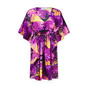 Purple kaftan with short sleeves, cinched waist, and bold tropical floral pattern—perfect for resort wear. | Tropicool Clothing