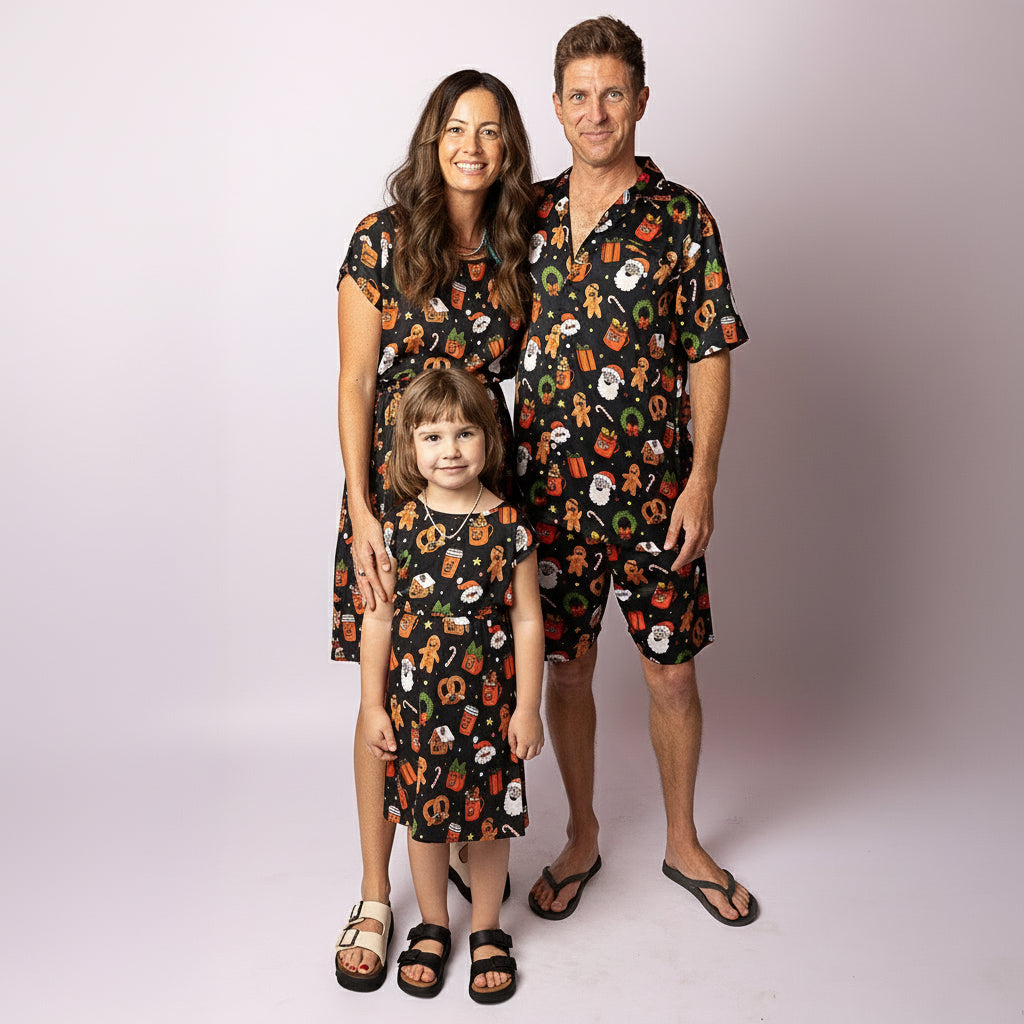 Family wearing matching Tropicool JingleVerse Christmas outfits, including the Alice adult dress, kids dress, and men’s shirt.