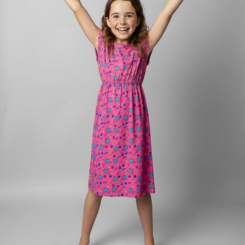 Kids Retro Vibe Bonnie Dress, knee length, features vibrant tropical patterns and festive colors. | Tropicool Clothing
